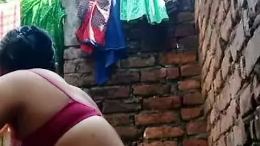 Village Bhabhi bathing nude in open backyard
