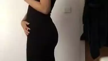 Indian woman with sexy body wears black dress that makes her look hot