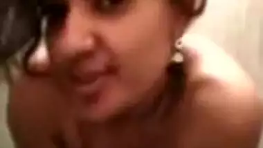 Desi girl poses on XXX camera before starting a shower sex show
