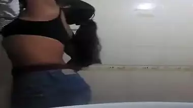 Slim Indian girl sneaks in bathroom to film solo porn clip for BF
