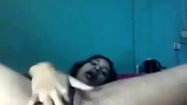 Desi female lies on back and wildly masturbates her XXX cherry on camera