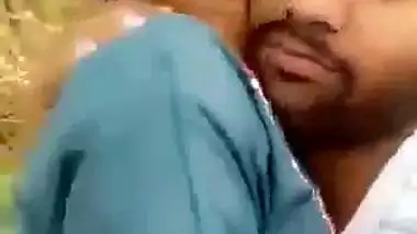 Indian outdoor sex of a guy sucking his GF’s tight boobs