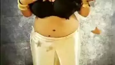 Indian aunty removes black top and pulls bra down taking hooters out