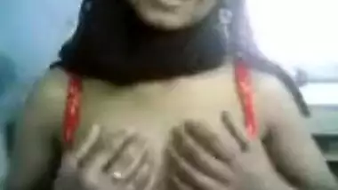Hot Indian chick taking her clothes off and...
