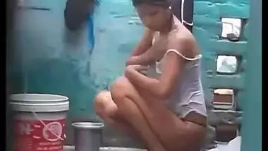 Erotic outdoor shower by pretty Desi chick filmed by sex voyeur