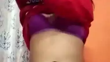 An 18-year-old desi nude girl strips and fingers her pussy