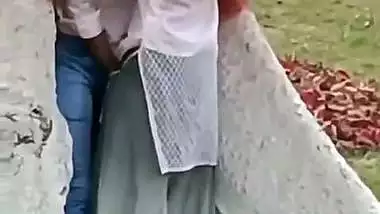 College couple enjoys outdoor sex below a big tree