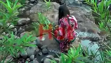 Young girl bathing in jungle showing hot bareback and cleavage