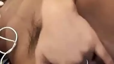 Naughty teen girl fingering her hairy pussy