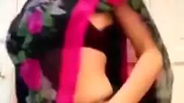 Woman in sari perform XXX dance and slowly strips down moving body