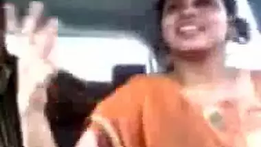 Tamil guy smooching and pressing boobs of cute girl in car