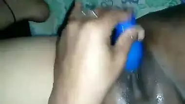 Hot Desi female shows off her smooth XXX pussy shoving a sex toy inside