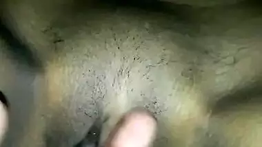 Fingering red pussy hole of GF on bed