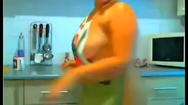 Nri chubby housewife in kitchen