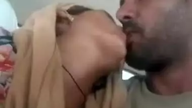 Bearded lad kisses Indian girlfriend's nipple in the backseat