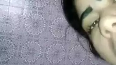 Desi teen in a green bra licks lipstick and fucks own XXX twat on camera