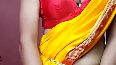 Indian shemale enjoys strip teasing and masturbating